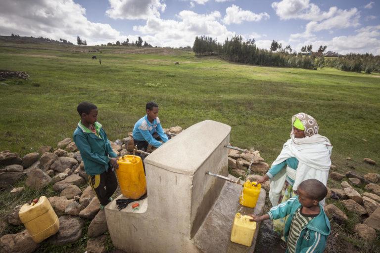 “We used to fetch water from a spring. We have to wait for hours as many people collect water from one spring. Now thanks to World Vision we are healthy, we are drinking clean water and wash our clothes with clean water,” Birke Alaye, 31, with 3 children. photo and copyright: Petterik Wiggers/Panos Pictures